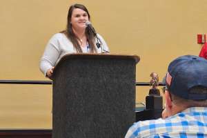 Jena accepting macchio award at wwett