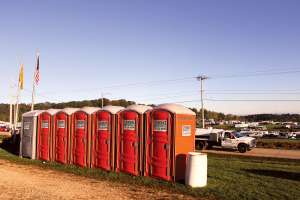 Setting Up Restrooms Along Rustic North Woods Paths