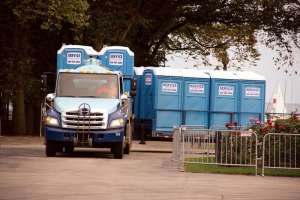 Truck delivering restrooms